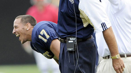 Dave Wannstedt pumps his fist in elation near the end of the Panthers' 21-20 win vs. Iowa Saturday.
