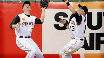 Left fielder Jason Bay has a bead on the ball, but center fielder Nate McLouth winds up making the catch on Washington's Cristian Guzman in the seventh inning last night at PNC Park.