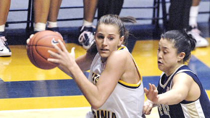 West Virginia's Meg Bulger drives against Pitt's Karlyle Lim.