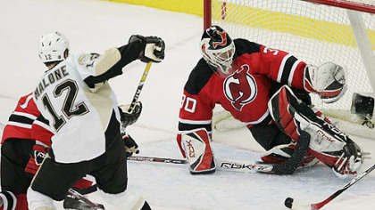 Ryan Malone scores off a rebound against New Jersey's Martin Brodeur.