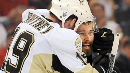 Ryan Whitney embraces Petr Sykora after Sykora made his prediction come true in the third overtime Monday night at Joe Louis Arena.