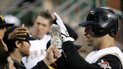 Xavier Nady, right, is greeted as he returns to the dugout after hitting a solo homer off Milwaukee Brewers pitcher Dave Bush in the fifth inning of a baseball game at PNC Park last night.