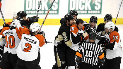 Penguins and Flyers fight during the second period Sunday.