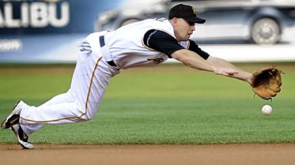 Pirates Jack Wilson can't quite come up with a ground ball hit by Colorado's Willy Taveras in the first inning.