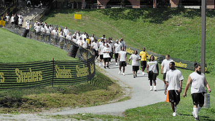 The Steelers take the field yesterday to do their run tests on the first day of training camp at St. Vincent College in Latrobe.