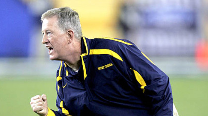 Bill Stewart exorts the Mountaineers last night in the Fiesta Bowl against Oklahoma. WVU named Stewart its new head football coach at a news conference this morning.
