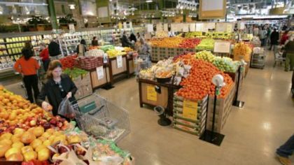Shoppers browse the fresh produce at the second, smaller Cleveland-area store that Whole Foods acquired last year.