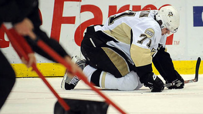 Workers at Joe Louis Arena tend to the ice Monday night, giving Evgeni Malkin a chance to catch his breath in the marathon that was Game 5.