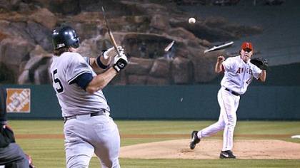Jason Giambi's broken bat sails at Angels pitcher John Lackey a few seasons ago.