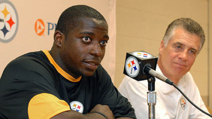 Rookie running back, Rashard Mendenhall talks with the media with Art Rooney Jr. at St. Vincent College at the start of training camp yesterday.