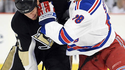 Jordan Staal,left, battles brother Marc Staal during game 5.