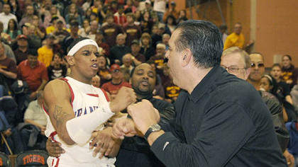 Terrelle Pryor, left, and coach Jim Nesser celebrate.