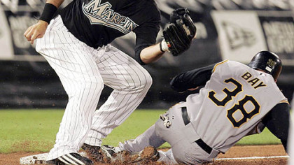 Jason Bay goes to third on a double steal in the fourth inning. He beats the throw to Florida's Jorge Cantu.