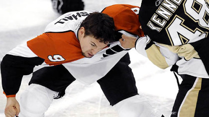 Flyers' Tyler Kennedy fights Flyers Scottie Upshall in the first period Sunday.