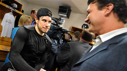 Penguins Sidney Crosby is congratulated by owner Mario Lemieux.