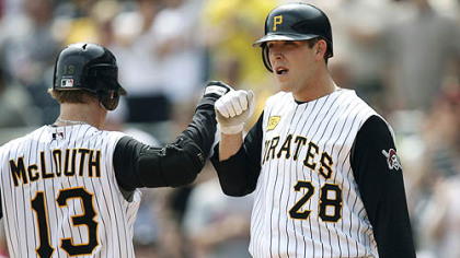 Nate McLouth and Paul Maholm celebrate at home plate after McLouth's two-run home run in the fifth inning against the Phillies yesterday at PNC Park. The Pirates won, 5-1.