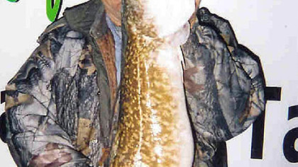 Bill Davis of Kane, Pa., holds a 411/2-inch burbot caught in Lake Erie.