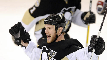 The Penguins' Adam Hall celebrates his empty net goal in the third period.