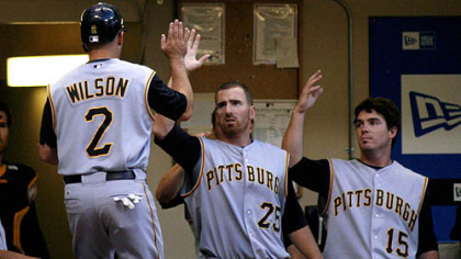 Adam LaRoche (25) and Andy LaRoche congratulate Jack Wilson after he scores in the second inning. It was one of the few bright spots.