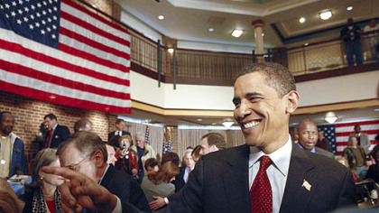 Sen. Barack Obama greets supports after holding a town hall meeting at Rossin Campus Center at Washington and Jefferson College in Washington, Pa., yesterday. The senator wears an American flag pin in his lapel after it was given to him by a disabled veteran. Radio and cable news commentators pounced on the senator when he was seen not wearing such a pin during the campaign in Iowa.