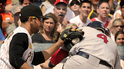 Cardinals runner Yadier Molina makes it safely to third ahead of the tag of Pirates third baseman Jose Bautista yesterday in the finale of their three-game series.