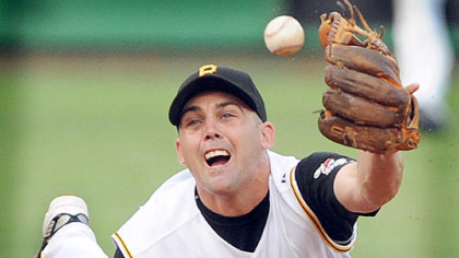 Shortstop Jack Wilson makes a diving stop then shuffles the ball to second baseman Freddy Sanchez for the out at second to end the inning against the Yankees last night at PNC Park.