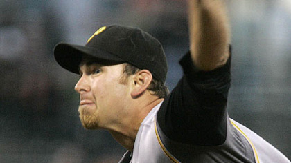 Zach Duke works against the San Francisco Giants in the first inning of yesterday's baseball gamein San Francisco. (AP Photo/Ben Margot)