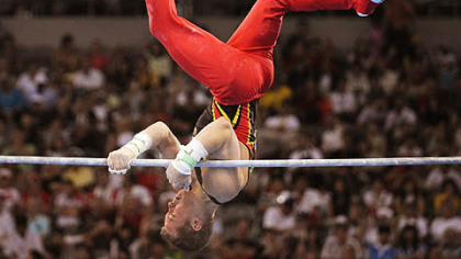 Germany's Fabian Hambuechen falls during the men's team final of the artistic gymnastics event.