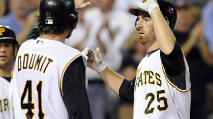 Ryan Doumit greets Adam LaRoche after hitting a grand slam off Dodgers starting pitcher Chad Billingsley in the fifth inning last night at PNC Park.