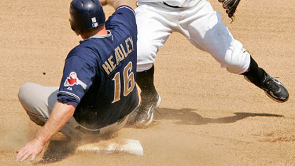 Second baseman Luis Rivas, right, turns a seventh inning double play over San Diego Padres' Chase Headley at PNC Park yesterday.