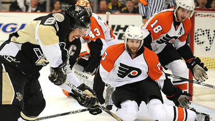 Penguins Sidney Crosby takes shot on Flyers goalie Martin Biron in the first period.