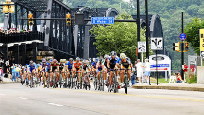 Cyclists come off the Hot Metal Bridge on the South Side yesterday during Stage 5 of the Tour of Pennsylvania.