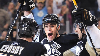 Pascal Dupuis celebrates his winning goal in overtime with Sidney Crosby and Kris Letang last night at Mellon Arena == the first meeting with the rival Philadelphia Flyers this season.