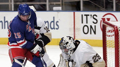 New York Rangers' Petr Prucha (25), of the Czech Republic, reaches for a rebound in front of Penguins goalie Marc-Andre Fleury during the first period of their NHL hockey game at Madison Square Garden in New York last night.