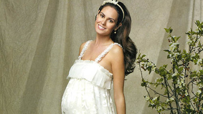 Embossed ankle-length lace-strap gown by Mimi Maternity.
