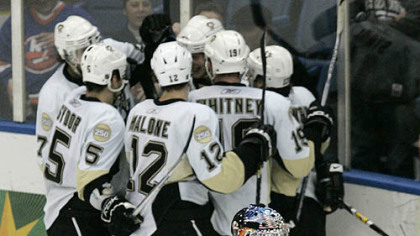Islanders goalie Rick DiPietro (39) and teammate Freddy Meyer (44) look away as the Penguins celebrate a goal by  Jordan Staal during the third period of last night's hockey game  in Uniondale, N.Y.