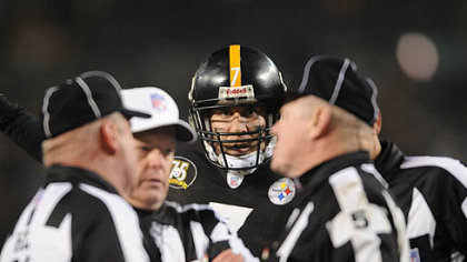 Roethlisberger listens in as referees confer before awarding the Steelers a touchdown. (Jan. 5, 2008)