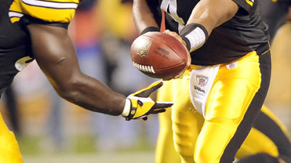 Byron Leftwich hands off to Rashard Mendenhall in the second quarter Thursday night. Mendenhall proved why he was the Steelers' first-round draft pick this year.