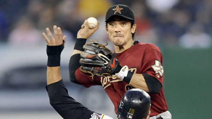 Pirates' Jose Bautista breaks up a double play in the sixth inning against the Astros' Kaz Matsui last night.
Jason Michaels hits a three-run home run last night.