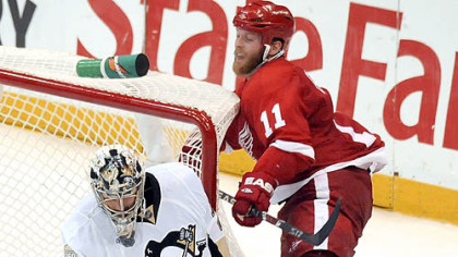 Marc-Andre Fleury makes one of his 55 saves as the Red Wings' Dan Cleary is called for goaltender interference in the second overtime of the Stanley Cup final last night in Detroit.