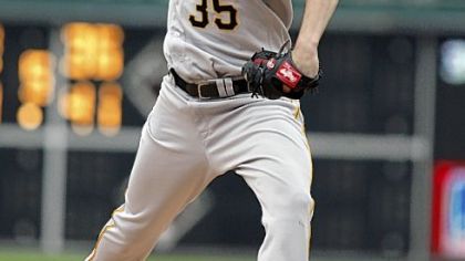 Pirates starting pitcher Jason Davis throws against the Phillies in the first inning yesterday in Philadelphia.