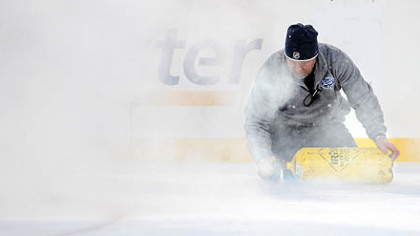 The "repair" men were as busy as the players yesterday, coming on at virtually every timeout to patch the temporary ice.