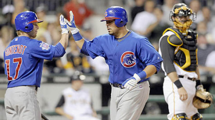 The Cubs' Geovany Soto is congratulated by teammate Mike Fontenot in the sixth inning after hitting a home run against the Pirates last night.