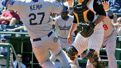 Raul Chavez, waits for the late relay throw Dodgers' Matt Kemp scores along with teammate Manny Ramiez on a fourth-inning single.
