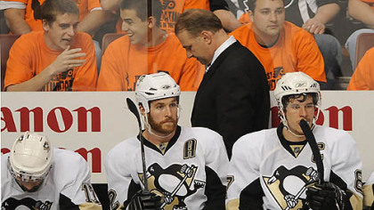Penguins coach Michel Therrien walks with his head down after the Flyers score their third goal.