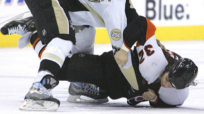 Georges Laraque sends the Philadelphia Flyers' Riley Cote to the ice in a first-period fight last night.