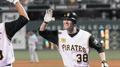 Jason Bay celebrates his first home run of the season, a tying shot in the bottom of the ninth inning off Chicago's Kerry Wood last night at PNC Park that forced extra innings.