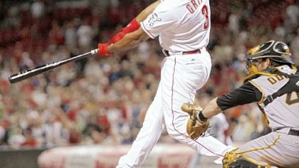 The Reds' Ken Griffey Jr. hits the winning two-run home run off Pirates closer Matt Capps in the ninth inning last night in Cincinnati.