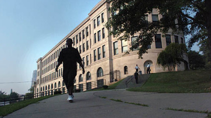 A student walks from the Centre Avenue side of Pittsburgh's venerable Schenley High School.
