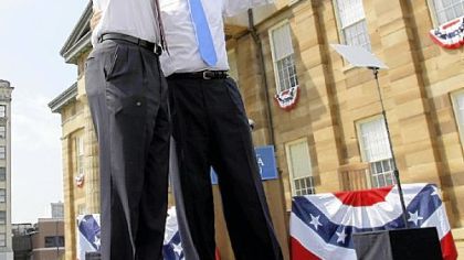 Democratic presidential candidate Sen. Barack Obama, D-Ill., with vice presidential running mate Sen. Joseph R. Biden Jr., D-Del., wave at a rally yesterday in front of the old state Capitol in Springfield, Ill. Mr. Obama introduced Mr. Biden as his running mate at the event.